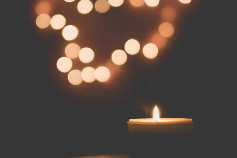 An image of candles in a dark room representing Christmas Eve Candlelight Service in Gold Canyon.