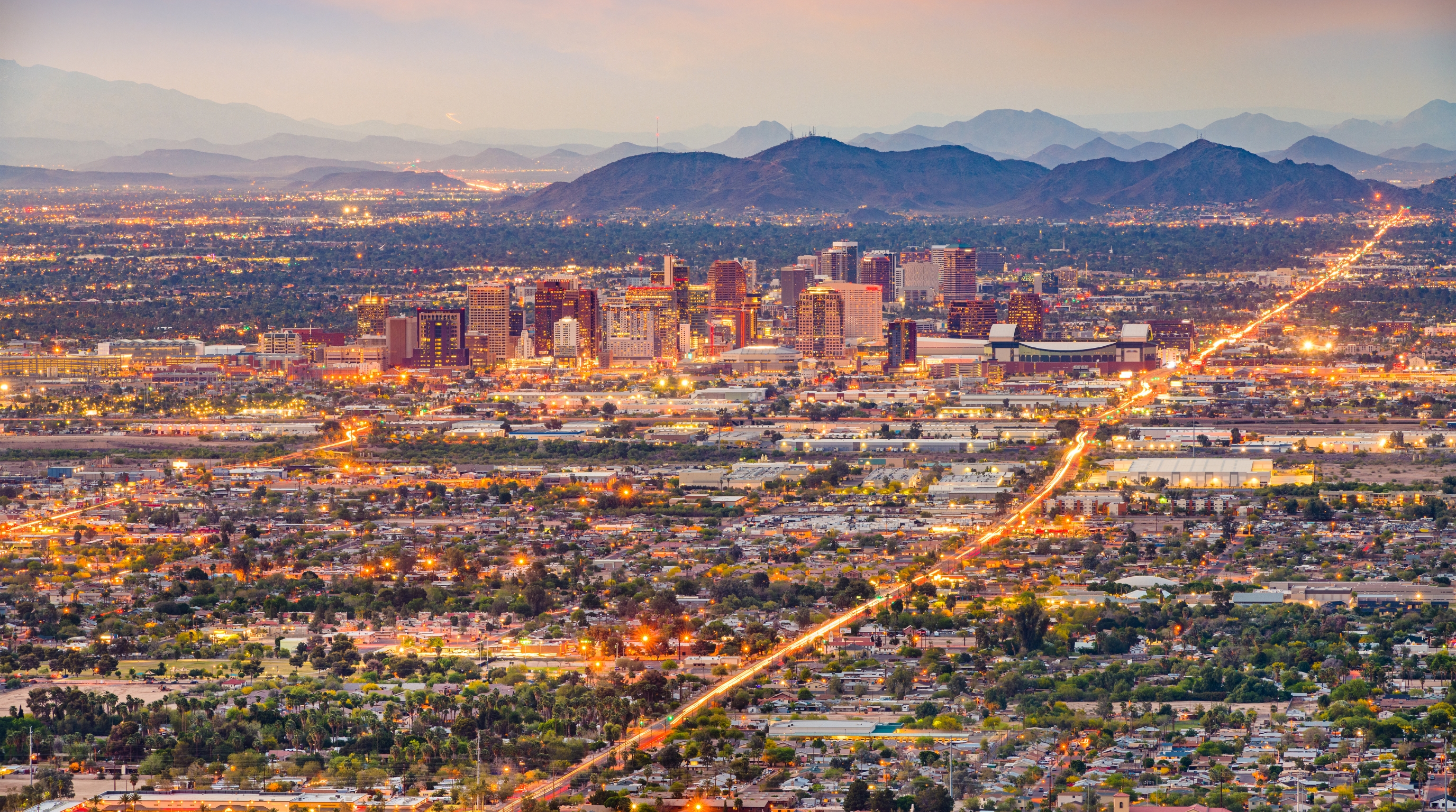 Phoenix and Mesa skyline at dusk from the East Valley Phoenix and East Mesa skyline at dusk — the East Valley community near Gold Canyon and Superstition Foothills Baptist Church