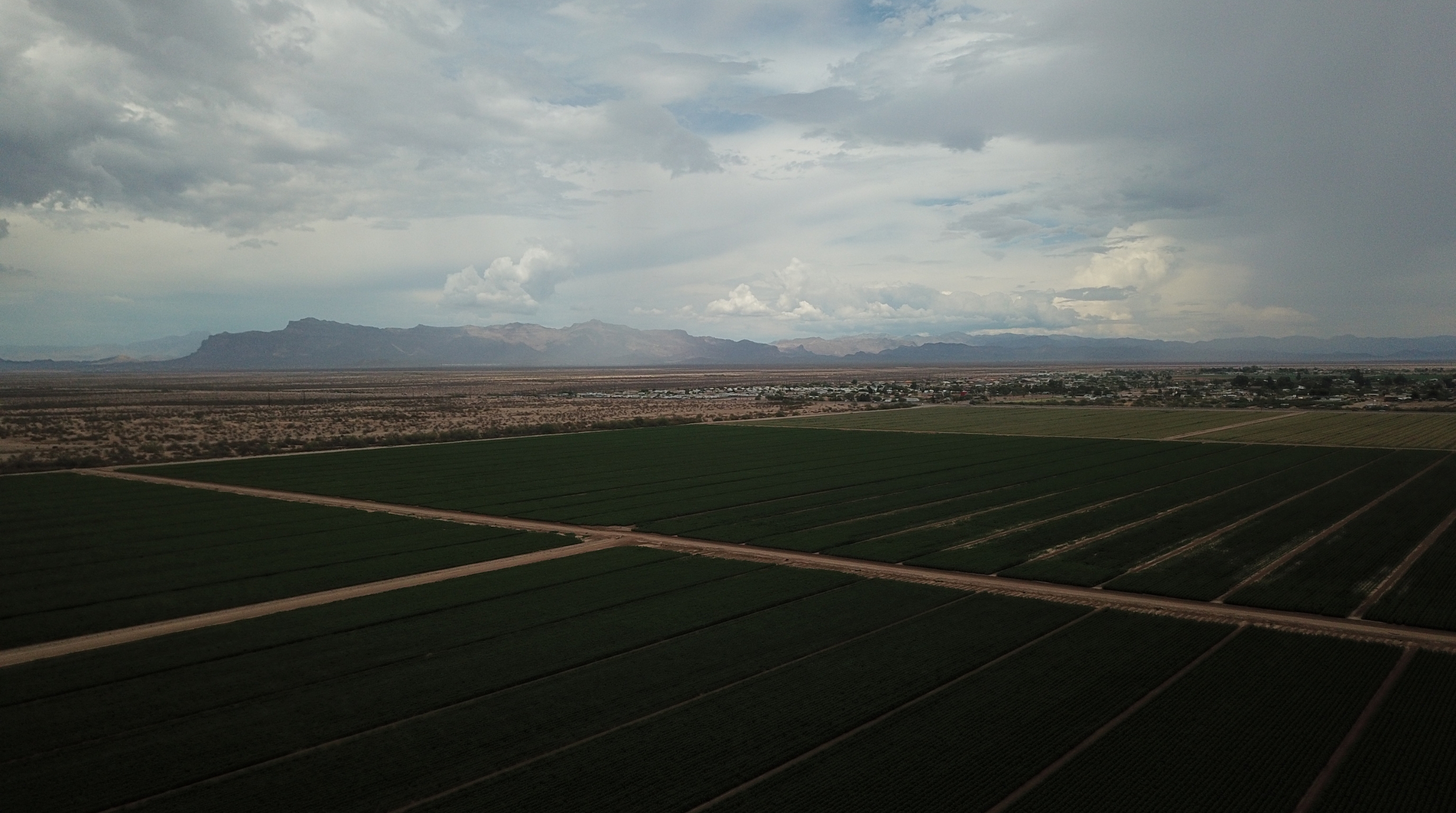 Farmland and Superstition Mountains near San Tan Valley AZ Farmland and Superstition Mountains viewed from San Tan Valley, AZ — Gold Canyon and Superstition Foothills Baptist Church lie just beyond those mountains