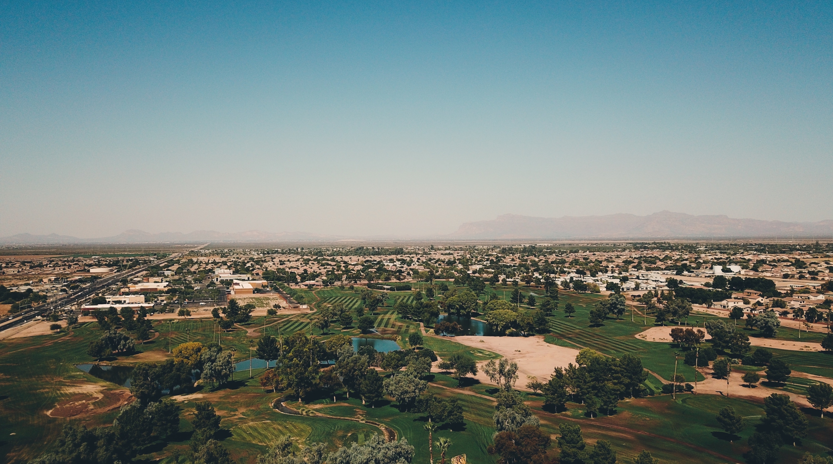 San Tan Valley AZ neighborhood and golf course aerial Neighborhood and golf course aerial in San Tan Valley, AZ — a thriving community near Gold Canyon and Superstition Foothills Baptist Church